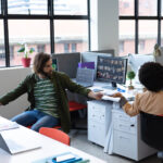 two-diverse-business-people-working-in-creative-of-2023-11-27-05-25-58-utc.jpg